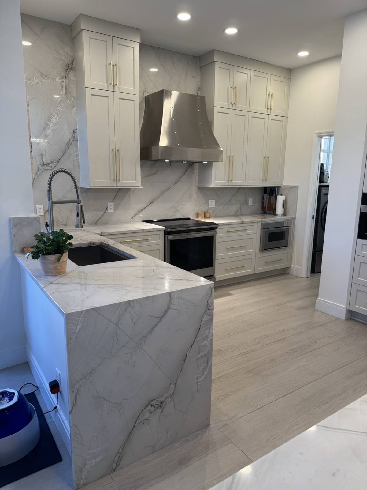 Waterfall edge island with marble countertop
