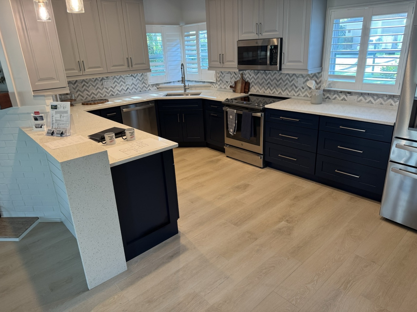 Kitchen with navy cabinets and stone countertops