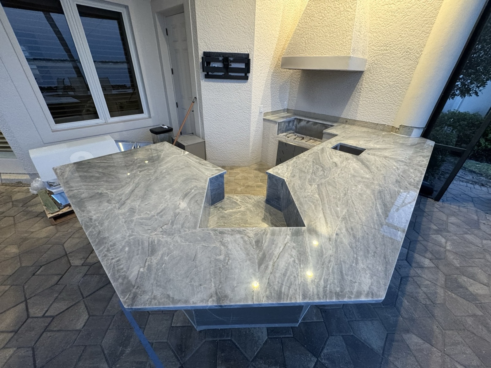 Large outdoor kitchen with stone countertops