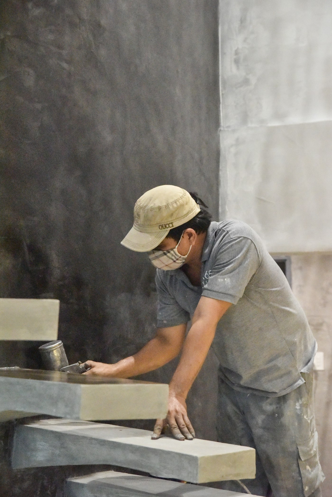 Master craftsman installing stone countertop